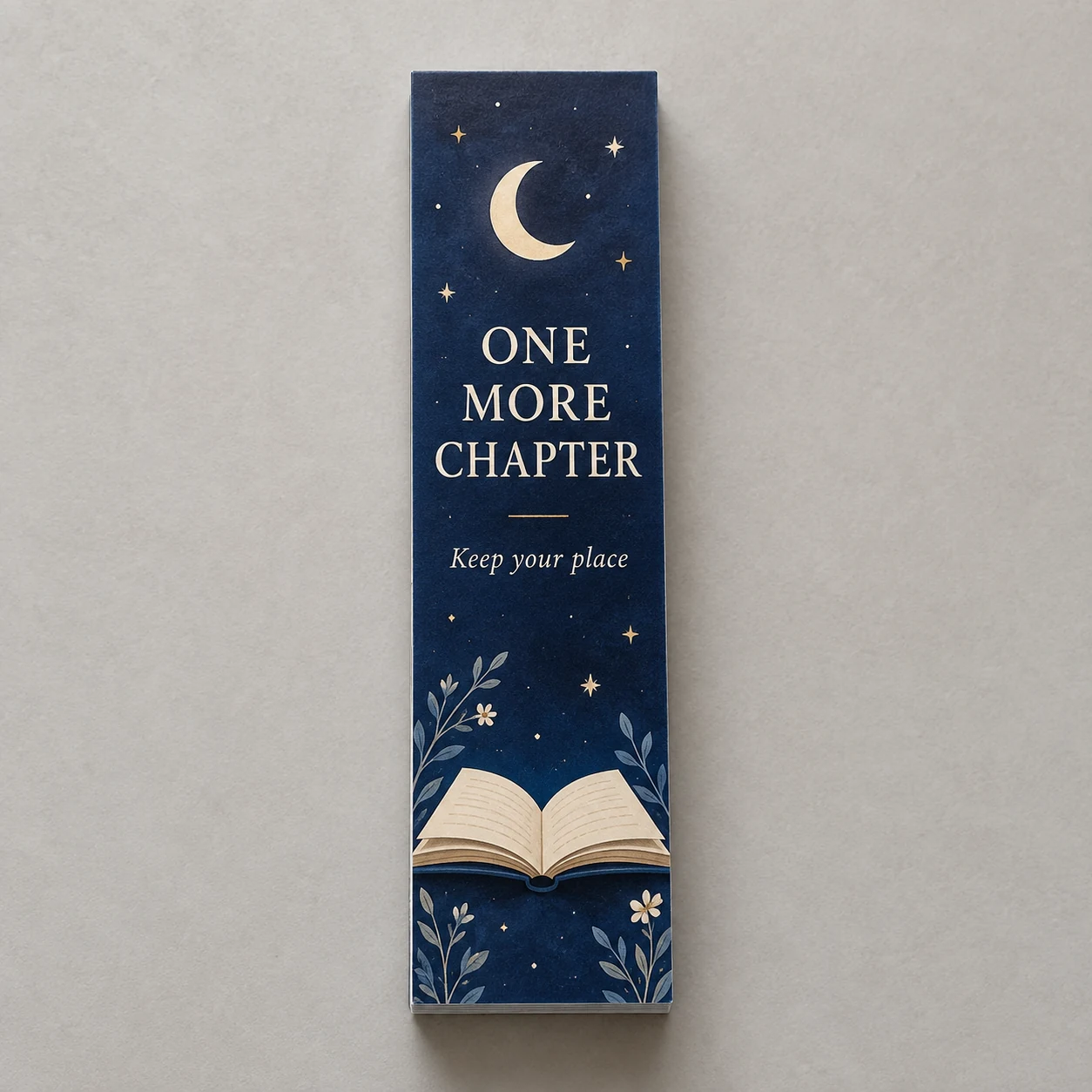 Bookstore bookmarks with One More Chapter artwork on a light studio surface
