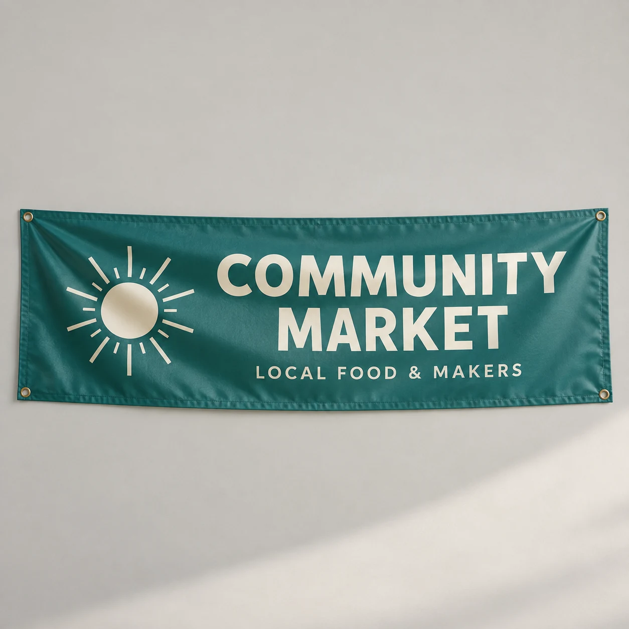 Printed community-market banner on a light studio surface